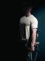 the trace mockup clothing featuring their T logo on the chest and a weapon on the hand