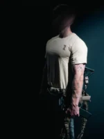 the trace mockup clothing featuring their T logo on the chest and a weapon on the hand