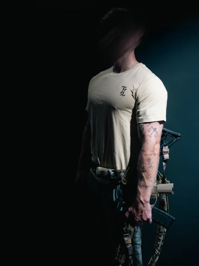 the trace mockup clothing featuring their T logo on the chest and a weapon on the hand
