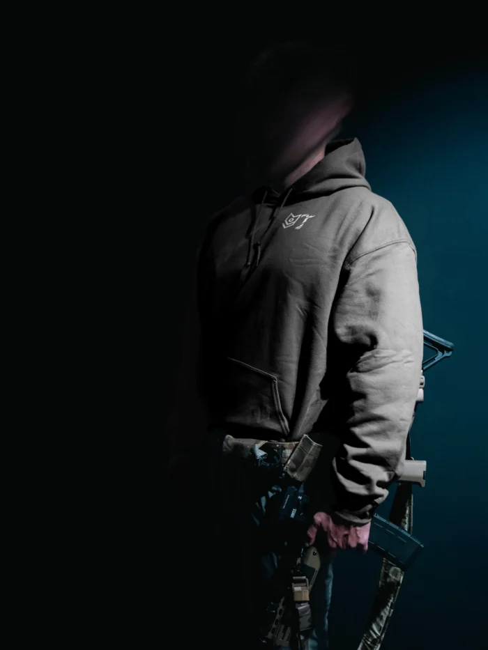 the trace mockup clothing featuring their T logo on the chest and a weapon on the hand