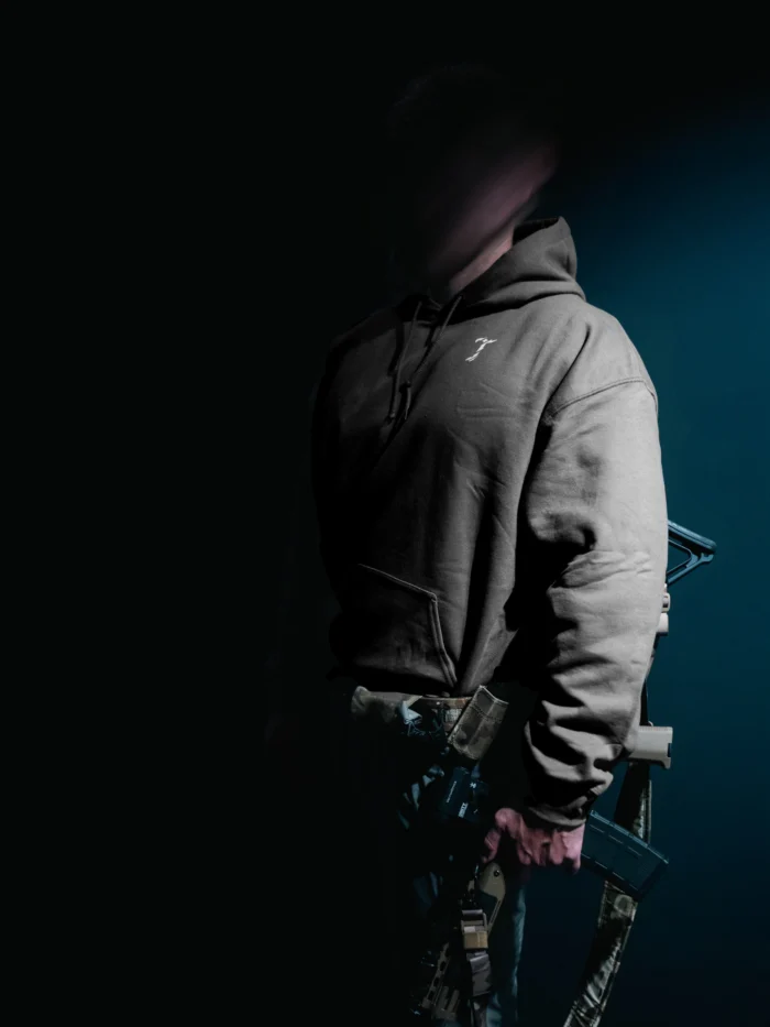 the trace mockup clothing featuring their T logo on the chest and a weapon on the hand