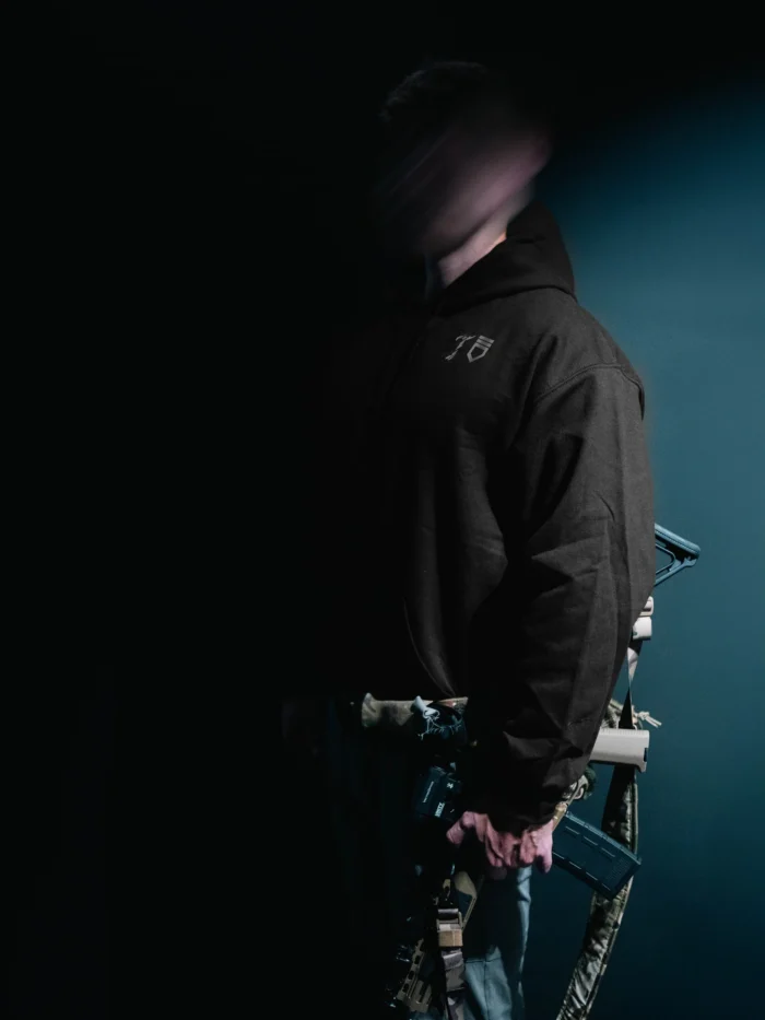 the trace mockup clothing featuring their T logo on the chest and a weapon on the hand