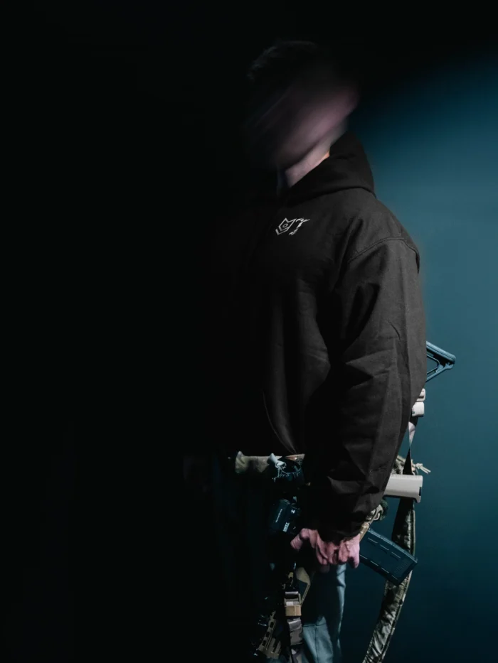 the trace mockup clothing featuring their T logo on the chest and a weapon on the hand