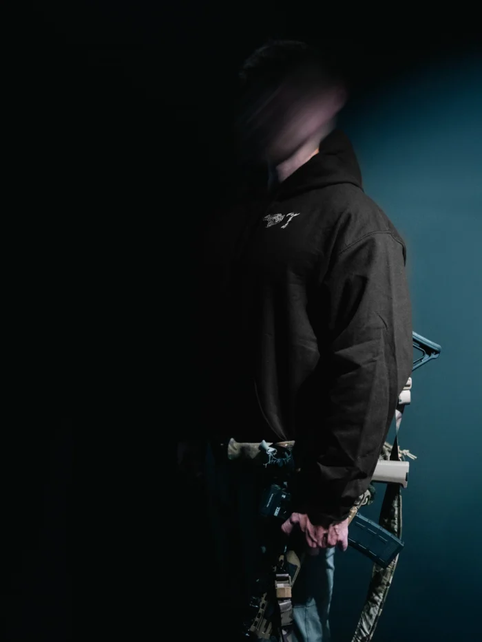 the trace mockup clothing featuring their T logo on the chest and a weapon on the hand