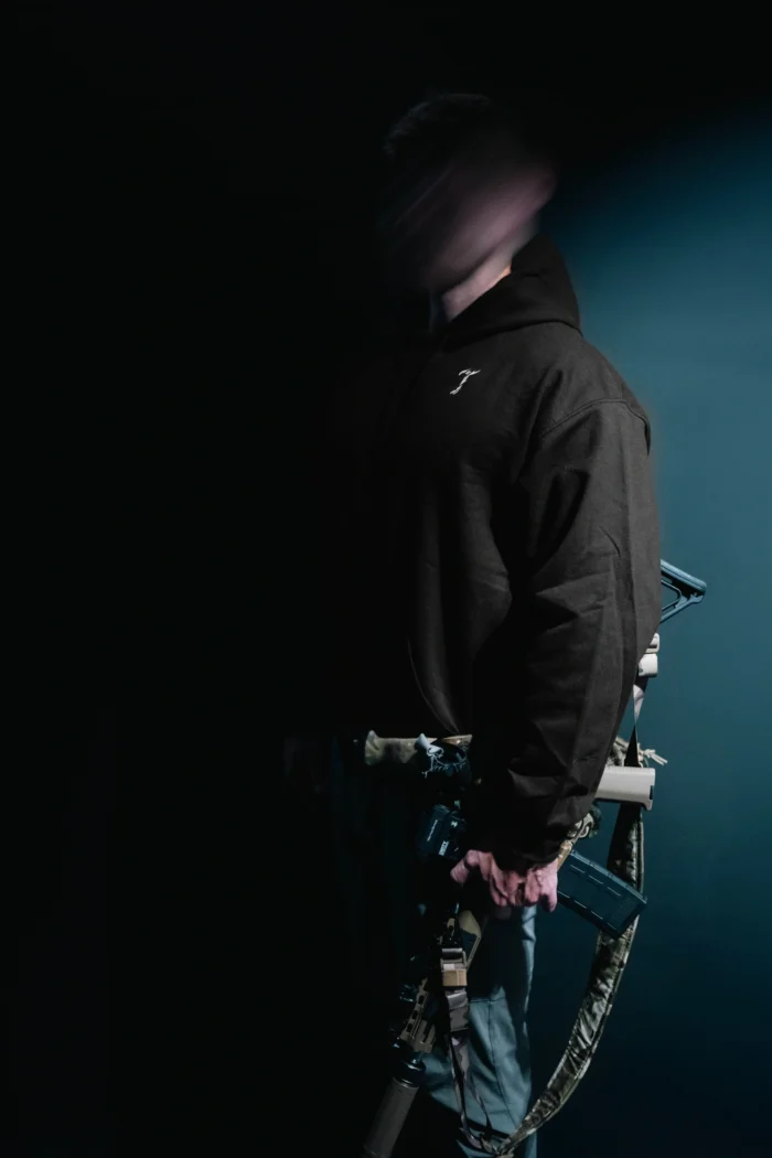 the trace mockup clothing featuring their T logo on the chest and a weapon on the hand