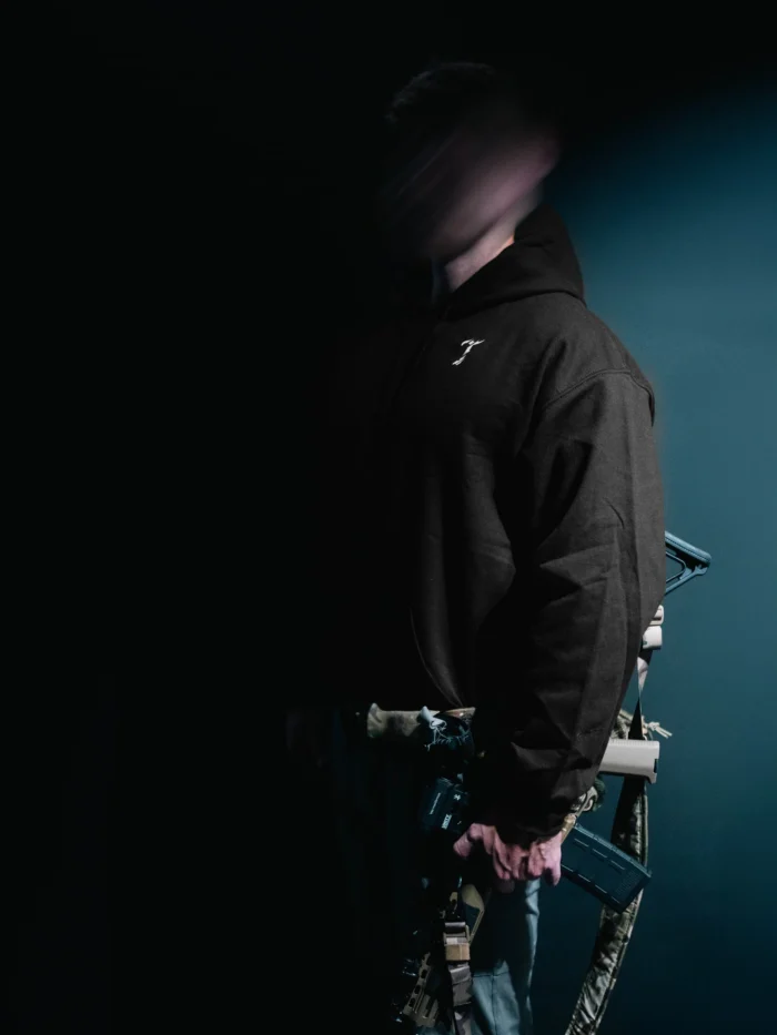 the trace mockup clothing featuring their T logo on the chest and a weapon on the hand