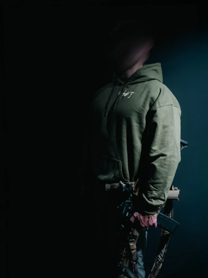 the trace mockup clothing featuring their T logo on the chest and a weapon on the hand