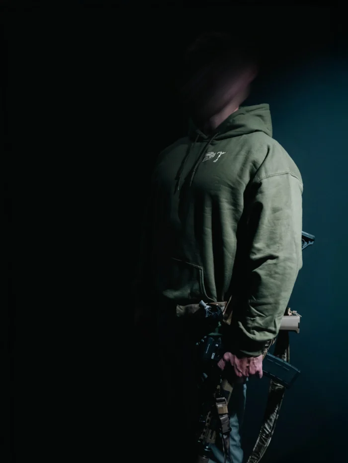 the trace mockup clothing featuring their T logo on the chest and a weapon on the hand