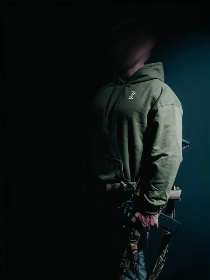 the trace mockup clothing featuring their T logo on the chest and a weapon on the hand