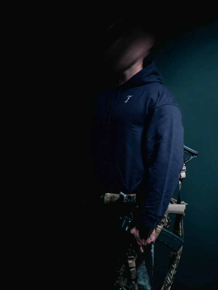 the trace mockup clothing featuring their T logo on the chest and a weapon on the hand