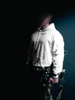 the trace mockup clothing featuring their T logo on the chest and a weapon on the hand