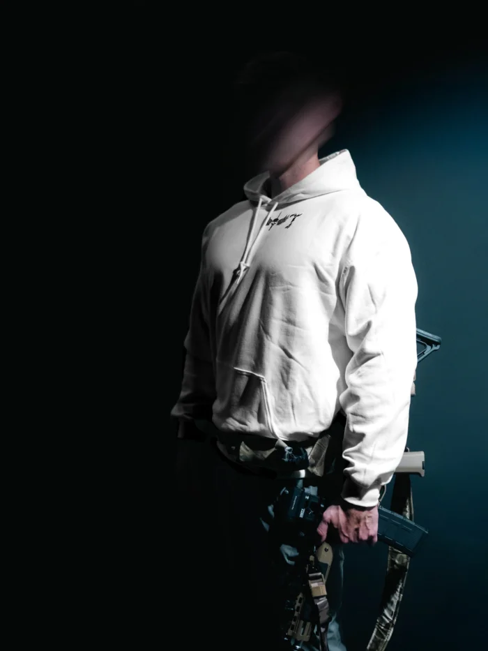 the trace mockup clothing featuring their T logo on the chest and a weapon on the hand