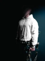 the trace mockup clothing featuring their T logo on the chest and a weapon on the hand