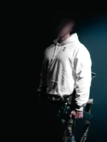 the trace mockup clothing featuring their T logo on the chest and a weapon on the hand