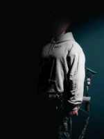 the trace mockup clothing featuring their T logo on the chest and a weapon on the hand