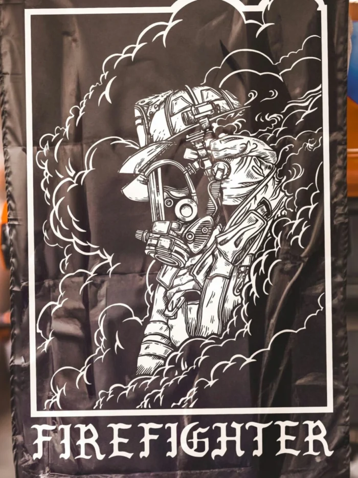 the trace flag featuring a firefighter standing in front of a firetruck